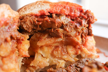 Masala steak Gatsby. Traditional South African fast food. Roll with steak and chips. 