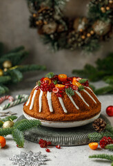 Christmas round cake with decorations on grey background with Christmas decorations. Holidays concept 
