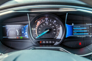 Speedometer with a blue luminous arrow and with many indicators and indicators	
