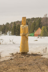Old wooden sculptures in the forest. Gorny Altai, Russia