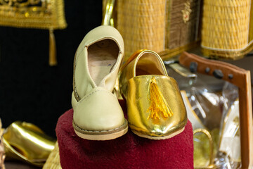 Close-up traditional colorful handmade kid's leather slippers in an old market in Tunis, Tunisia.