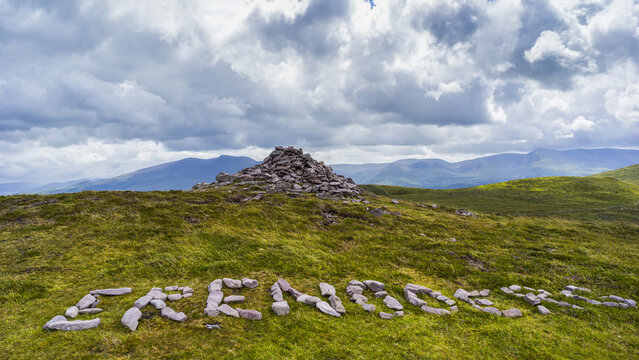 Cairn and word written in stones, Brandon Point, Dingle Peninsula; Castlegregory, County Kerry, Ireland