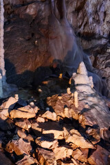 spectacular stalagmites and stalactites formations. scene inside one of the longest caves in romania. geological formation of ursus caves