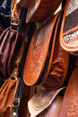 Close-up traditional handmade leather bags in an old market in Tunis, Tunisia.
