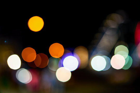 Out of focus night coloured lights at Coney Island and Luna Park; Coney Island, New York, United States of America