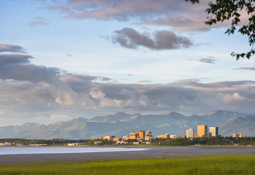 The city of Anchorage skyline as seen from Earthquake Park on a cloudy summer's day in South-central Alaska; Anchorage, Alaska, United States of America
