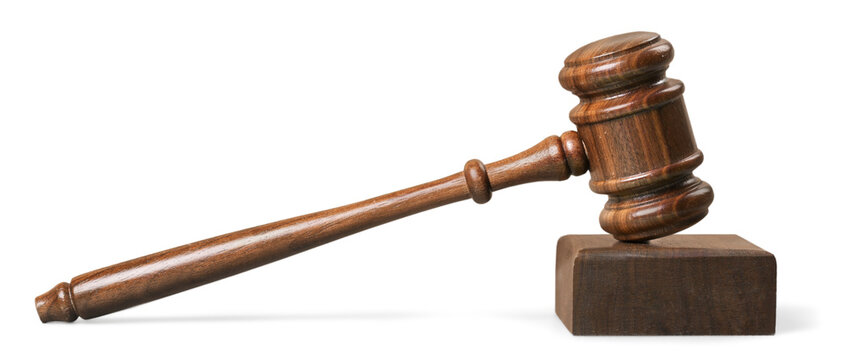 A wooden judge gavel or mallet and soundboard