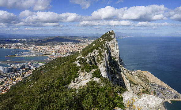 View of the coastline of Gibraltar with the peaked rock formation in the foreground; Gibraltar