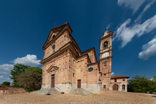 Sommariva del Bosco, Cuneo, Italy - May 01, 2022: Parish church of Santi Giacomo e Filippo (18th century) with the bell tower with clock - Powered by Adobe