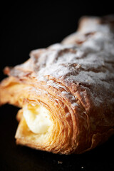 Cream puff bread on a black background	