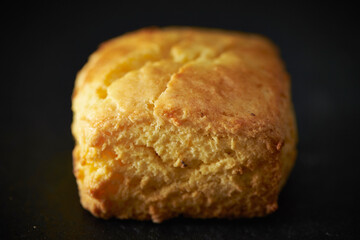 Plain scones on a black background	