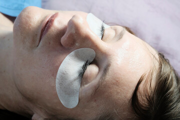 Young woman on spa treatments. Artificial eyelashes, extension. Beauty, salon.