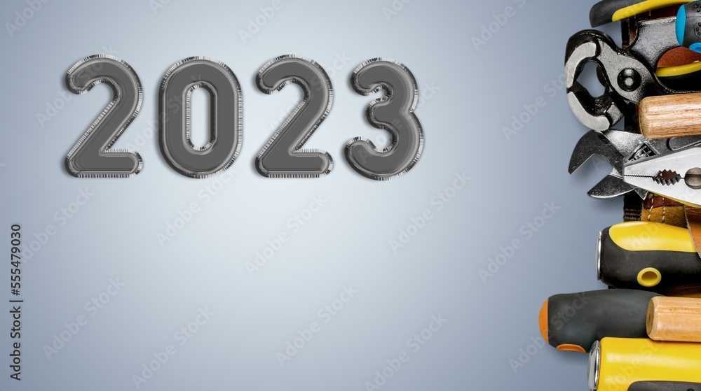 Wall mural 2023 numbers for new year and construction tools