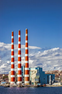 Tufts Cove Electrical Generating Station with smoke stacks in the Dartmouth harbour; Dartmouth, Halifax, Nova Scotia, Canada