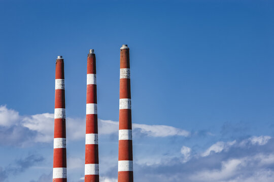 Three smoke stacks at Tufts Cove Electrical Generating Station; Dartmouth, Halifax, Nova Scotia, Canada