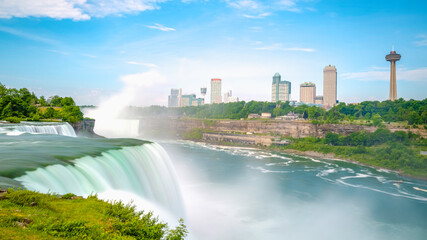 Niagara Falls Summer Travel Landscape Series, view of Canadian Side Skyline from America Falls in New York, USA, long exposure photography with silky flowing waterfall