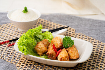HANDMADE fried PRAWN ROLL with chopsticks served in dish isolated on table top view of singapore food