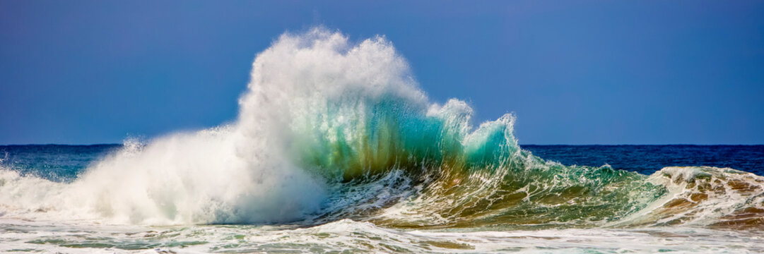 Tropical ocean wave crashing and splashing, Na Pali Coast; Kauai, Hawaii, United States of America