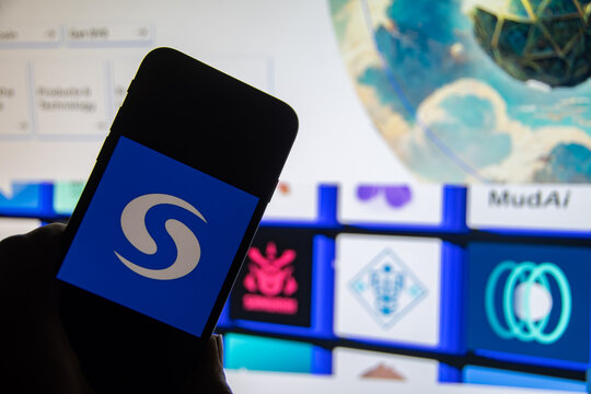 Rheinbach, Germany  20 December 2022,  The logo of the cryptocurrency "Syscoin" on the display of a smartphone in front of the website (focus on the logo)
