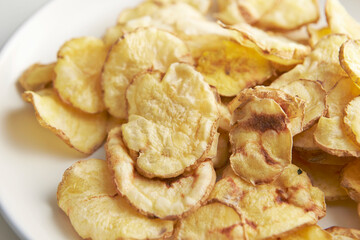 dry potato chips on a plate