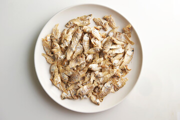Dried small baby fish on a plate