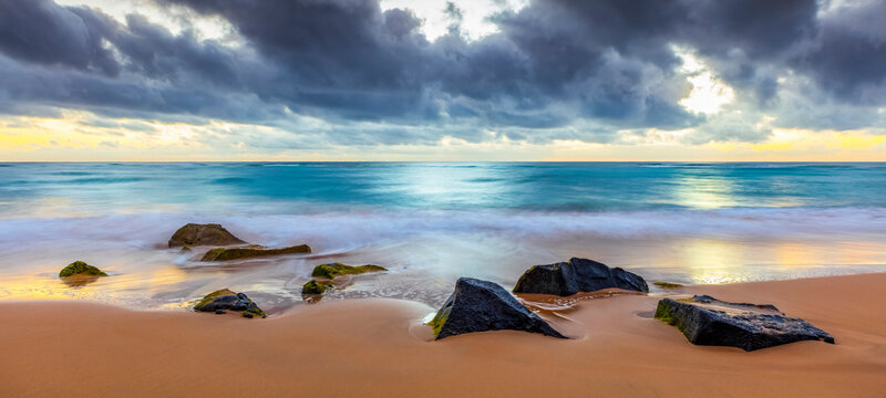 Sunrise over beach and ocean; Kauai, Hawaii, United States of America