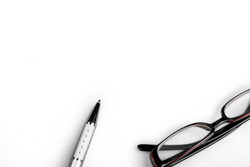 Business silver pen and modern glasses for reading
