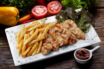 Grilled chicken with potato on isolated background