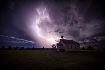 Beautiful and bright electrical storm with a church in the foreground; Moose Jaw, Saskatchewan, Canada