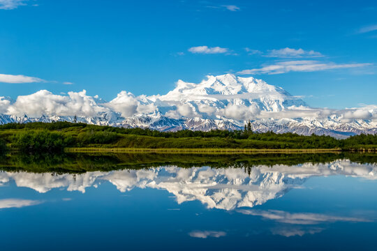 View of Denali and it's reflection in Reflection Pond taken from the park road while driving to Wonder Lake, Denali National Park and Preserve; Alaska, United States of America