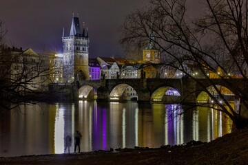 Naklejka premium Mystic Charles bridge at night and Vltava river in Prague