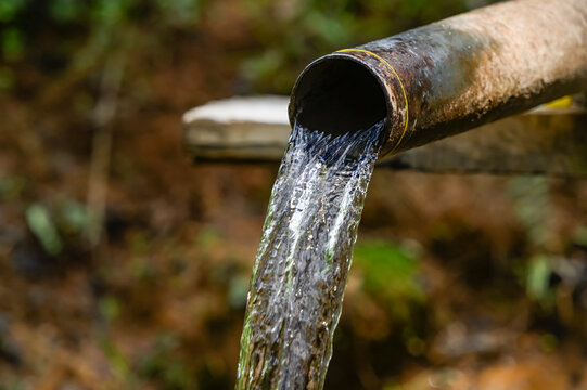 Clean water flowing from an old pipe; Yawngshwe, Shan State, Myanmar