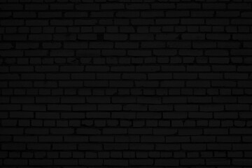 Old black brick wall. Grunge background