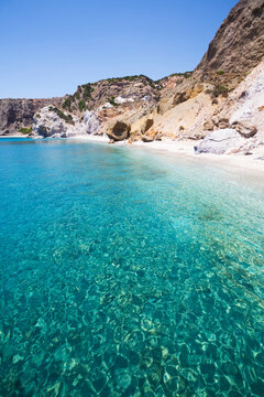 Turquoise ocean water along the coast of Galazia Nera Bay; Polyaigos Island, Cyclades, Greece
