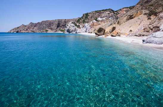 Turquoise ocean water along the coast of Galazia Nera Bay; Polyaigos Island, Cyclades, Greece