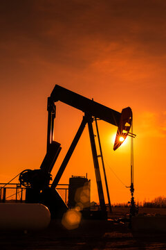 Pumpjack at sunset; Alberta, Canada