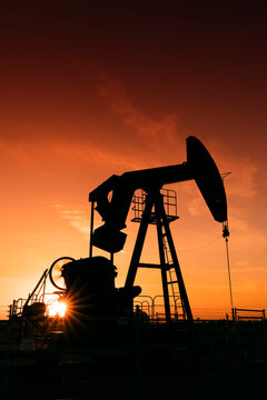 Pumpjack at sunset; Alberta, Canada