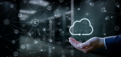 Hand showing a data cloud in a network of connections .