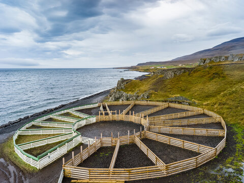 A circular farming structure a animal enclosures along the coast; Hunaping vestra, Northwestern Region, Iceland