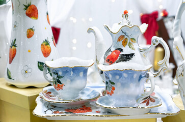Porcelain tea-coffee set with rowan branches and bullfinch.