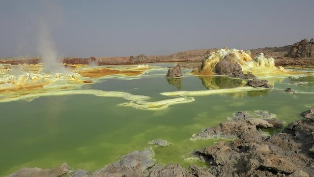 Dallol acid lakes in the Danakil depression in Ethiopia, Africa. Aerial drone flight over bubbling hydrothermal fields with sulfur, iron and other mineral deposits, wonderful natural scenery