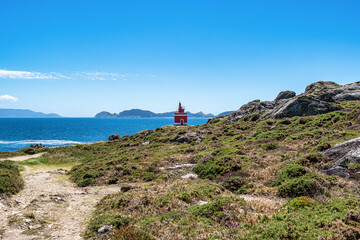 Red lighthouse in Punta Robaleira, Costa da Vela, Pontevedra, Galicia, Spain