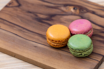 French macaroons on a wooden background 