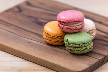 French macaroons on a wooden background 