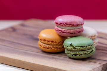 French macaroons on a wooden background 
