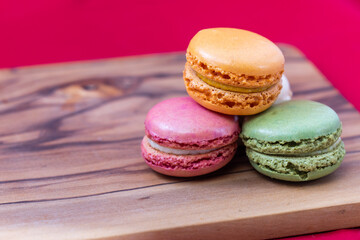 French macaroons on a wooden background 