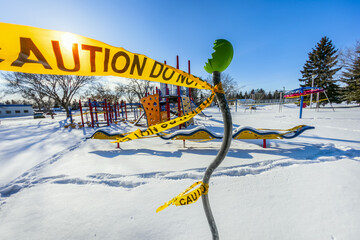 A playground cordoned off with caution tape during the COVID-19 World Pandemic; Edmonton, Alberta, Canada