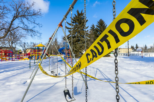 A playground cordoned off with caution tape during the COVID-19 World Pandemic; Edmonton, Alberta, Canada