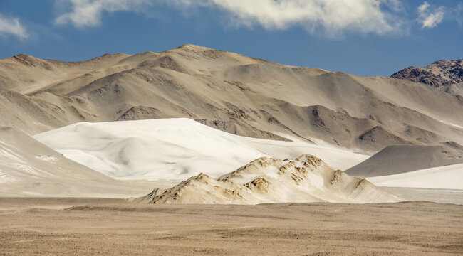 Panoramic landscape of high altitude desert with sand, hills and mountains in the Andes; Antofagasta de la Sierra, Catamarca, Argentina