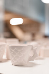 selective focus of ceramic mugs. art concept. vertical